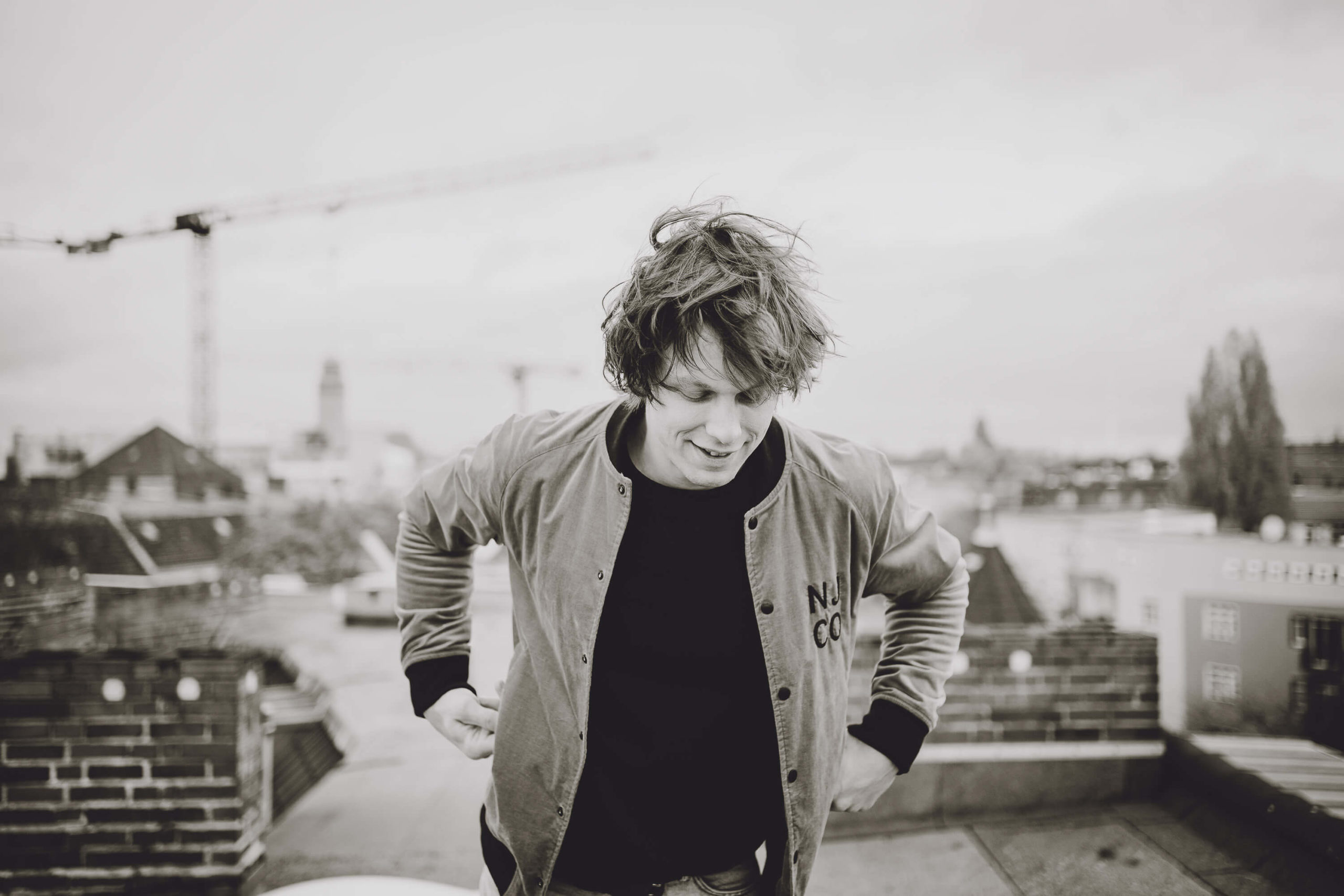 musician Simon Meyer walks on rooftop in Berlin-Neukölln